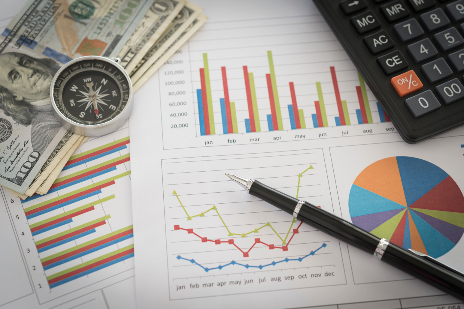 graphs with lines, money, calculator